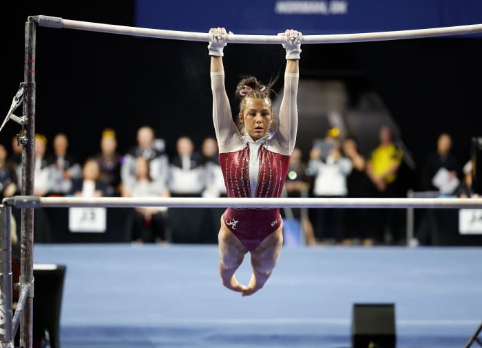 University of Alabama gymnast Cam Machado performs bars exercise during the 2023 NCAA women's gymnastics regional at Lloyd Noble Center.